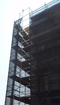 Top of construction site secured with debris netting