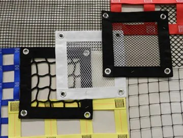 Assortment of mesh and netting samples with various sizes, colors, and patterns, displayed with color-coded borders and metal eyelets.