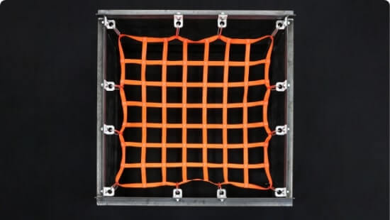 Orange hatch netting attached to a metal box