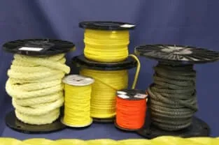 Assorted colorful kevlar rope spools on a blue backdrop.