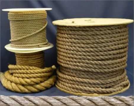 Several spools and coils of rope in varying thicknesses and colors, displayed against a blue backdrop.