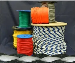 A collection of spools with different types and colors of ropes and cords