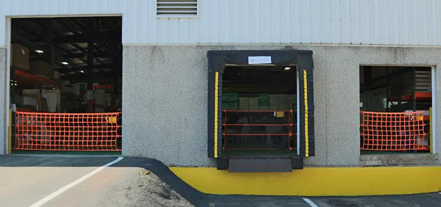 Three loading dock doors with our dock safety barriers in place