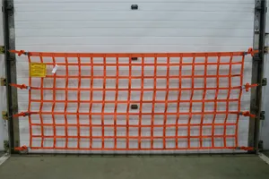 Front view of a wall mounted loading dock safety net