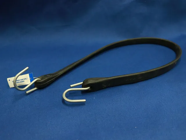 Black rubber strap with metal hooks at both ends, displayed on a deep blue fabric background with a product label attached.