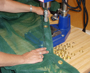 Grommeting Dumpster Cover